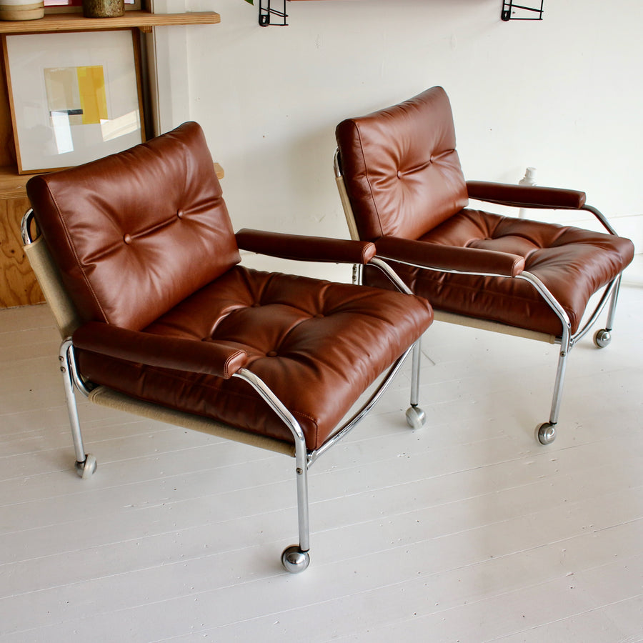 Swedish tubular chrome armchairs on castors