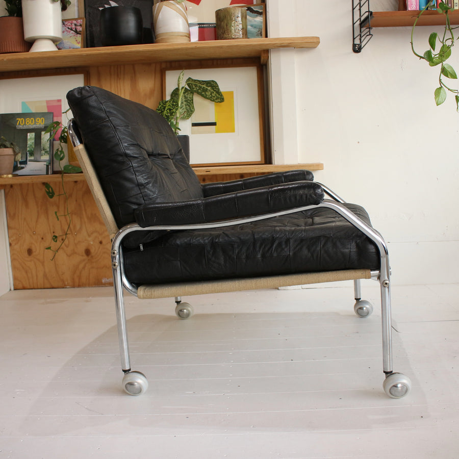 Black leather Swedish tubular chrome armchairs