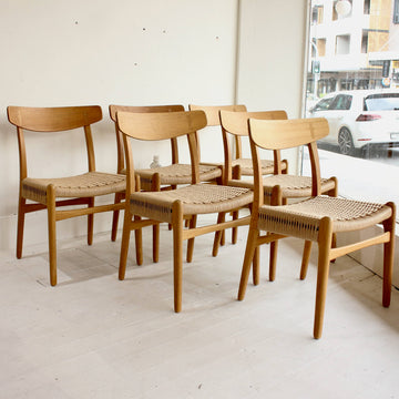 Set of six Hans Wegner oak dining chairs. Model CH23