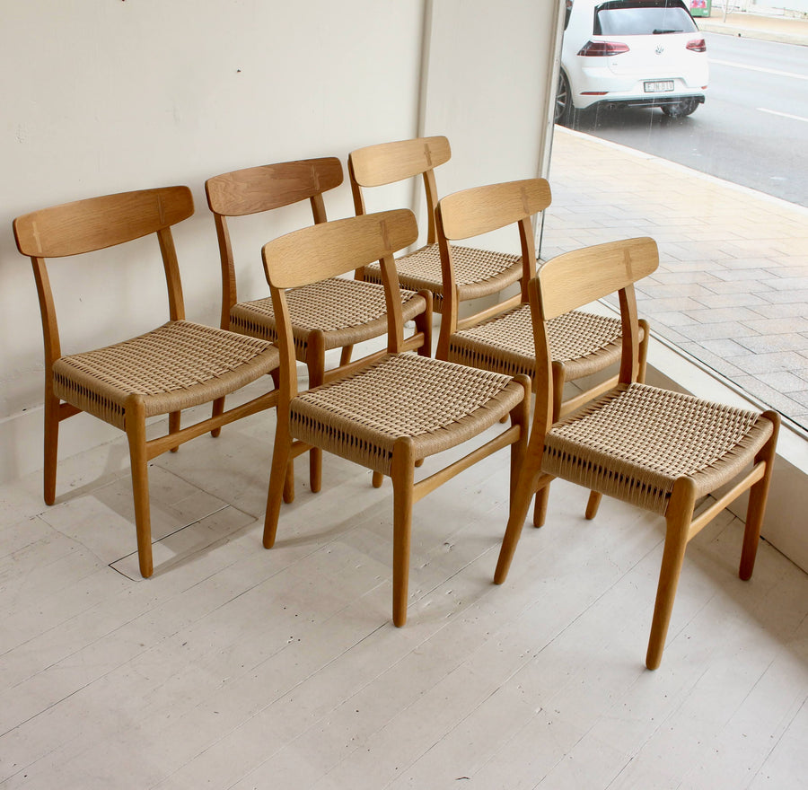 Set of six Hans Wegner oak dining chairs. Model CH23