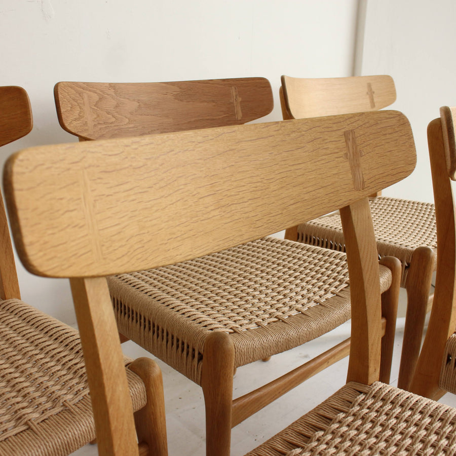 Set of six Hans Wegner oak dining chairs. Model CH23