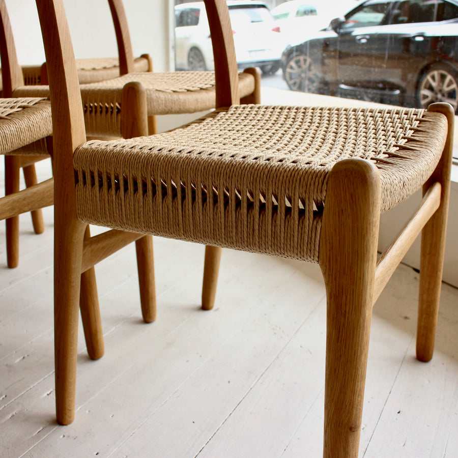 Hans Wegner teak and oak dining chairs. Model CH23