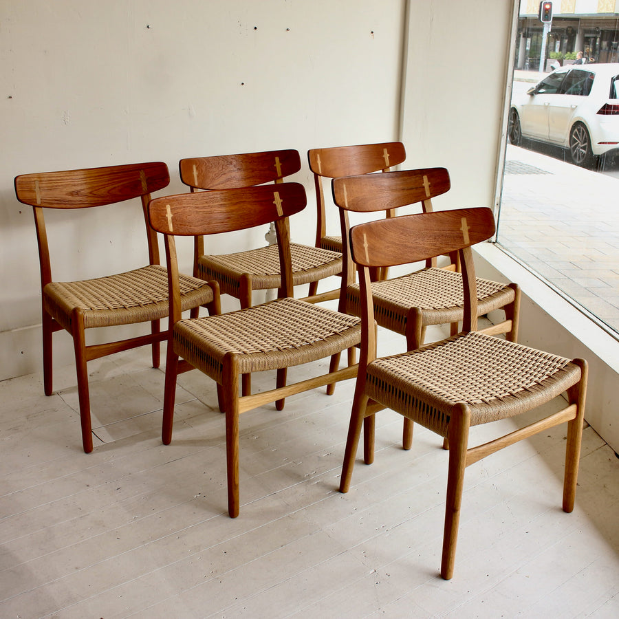 Hans Wegner teak and oak dining chairs. Model CH23
