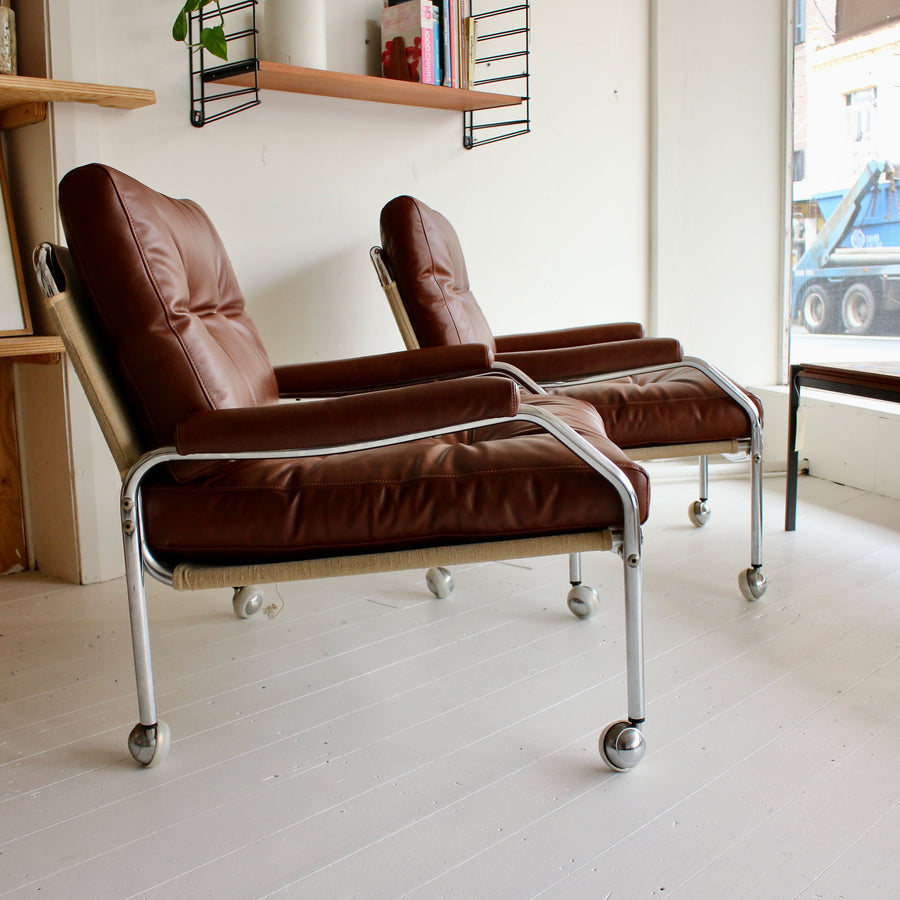Swedish tubular chrome armchairs on castors