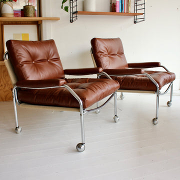 Swedish tubular chrome armchairs on castors