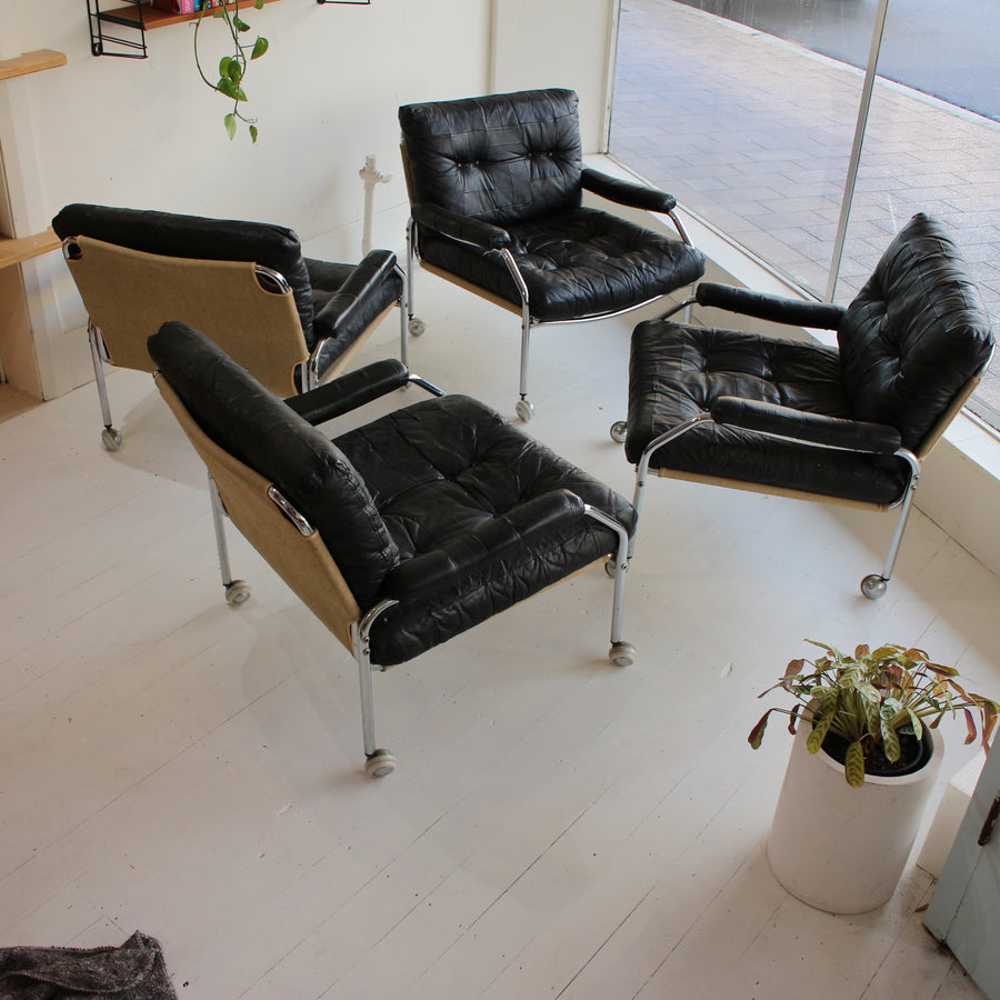 Black leather Swedish tubular chrome armchairs