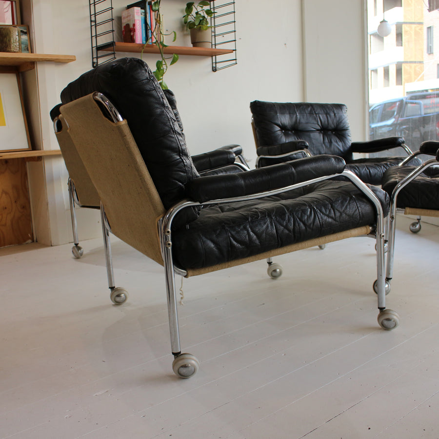 Black leather Swedish tubular chrome armchairs
