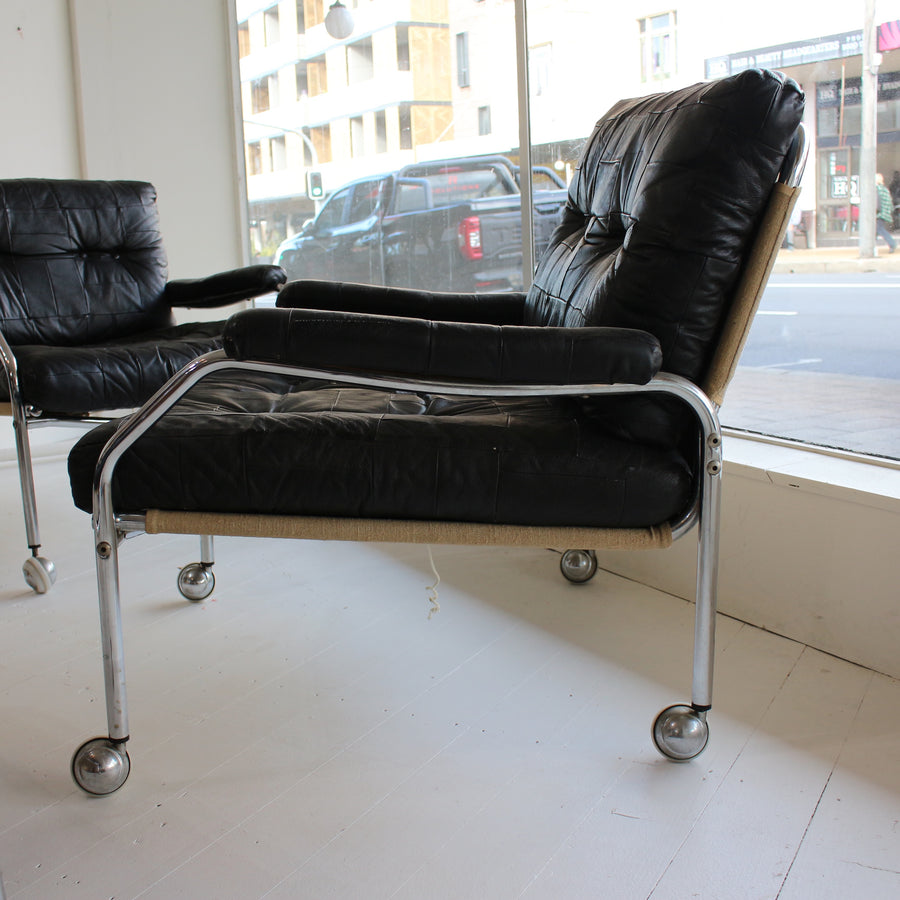 Black leather Swedish tubular chrome armchairs