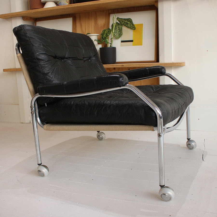 Black leather Swedish tubular chrome armchairs